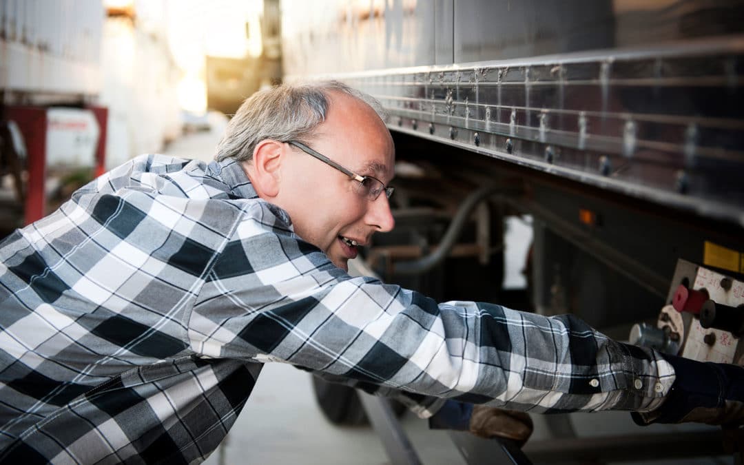 driver inspecting truck